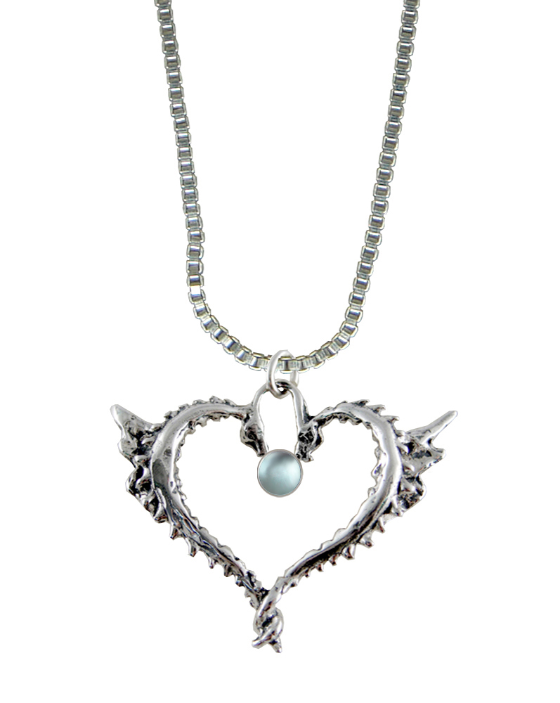 Sterling Silver Dragon Heart Pendant With Faceted Blue Topaz